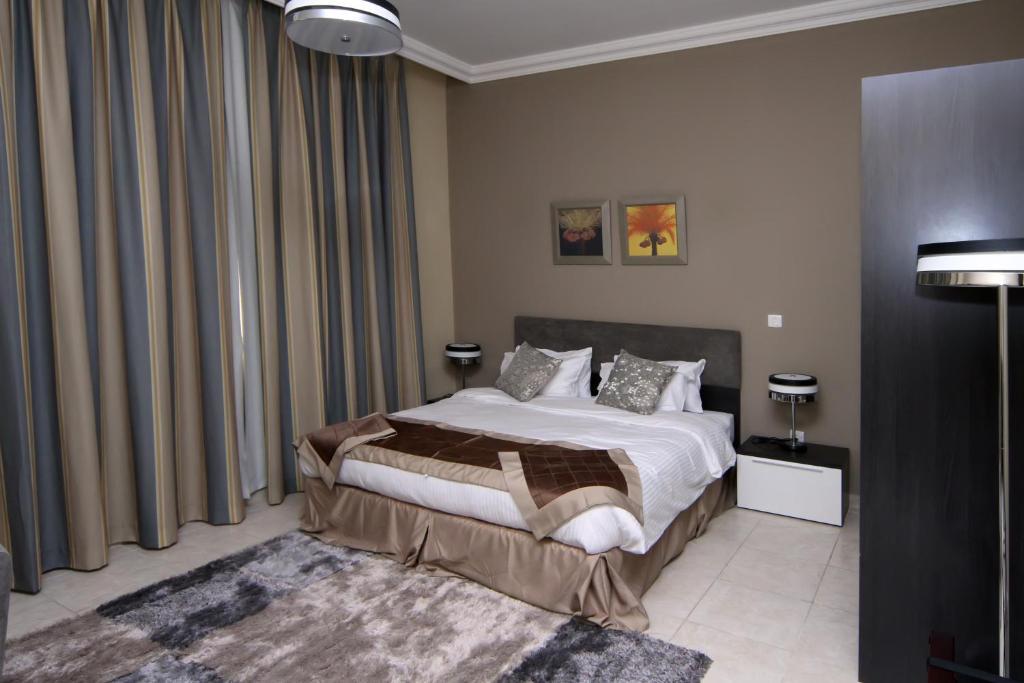 דוחה Magnum Hotel & Suites West Bay חדר תמונה